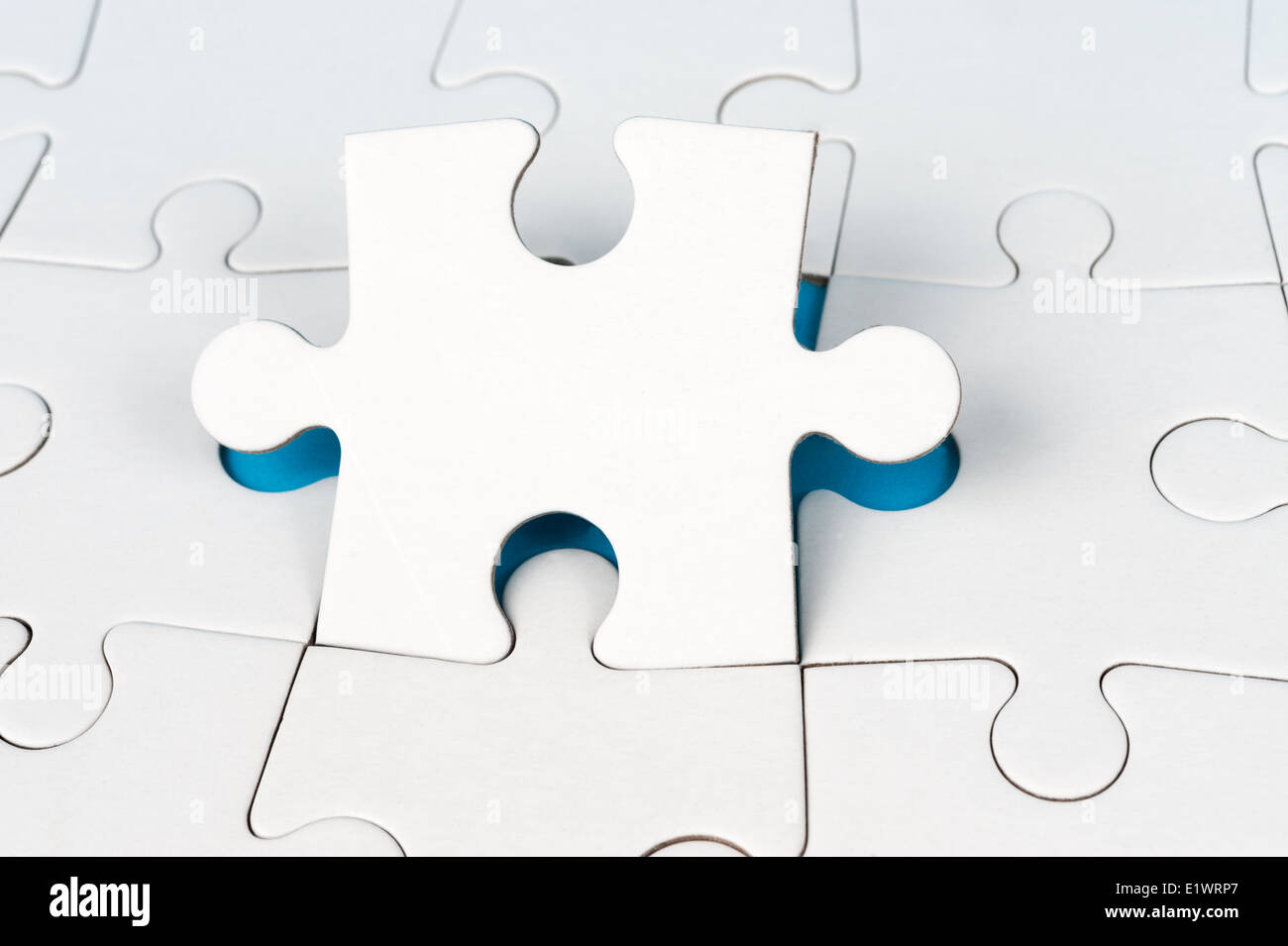 Group of white paper jigsaw puzzles Stock Photo
