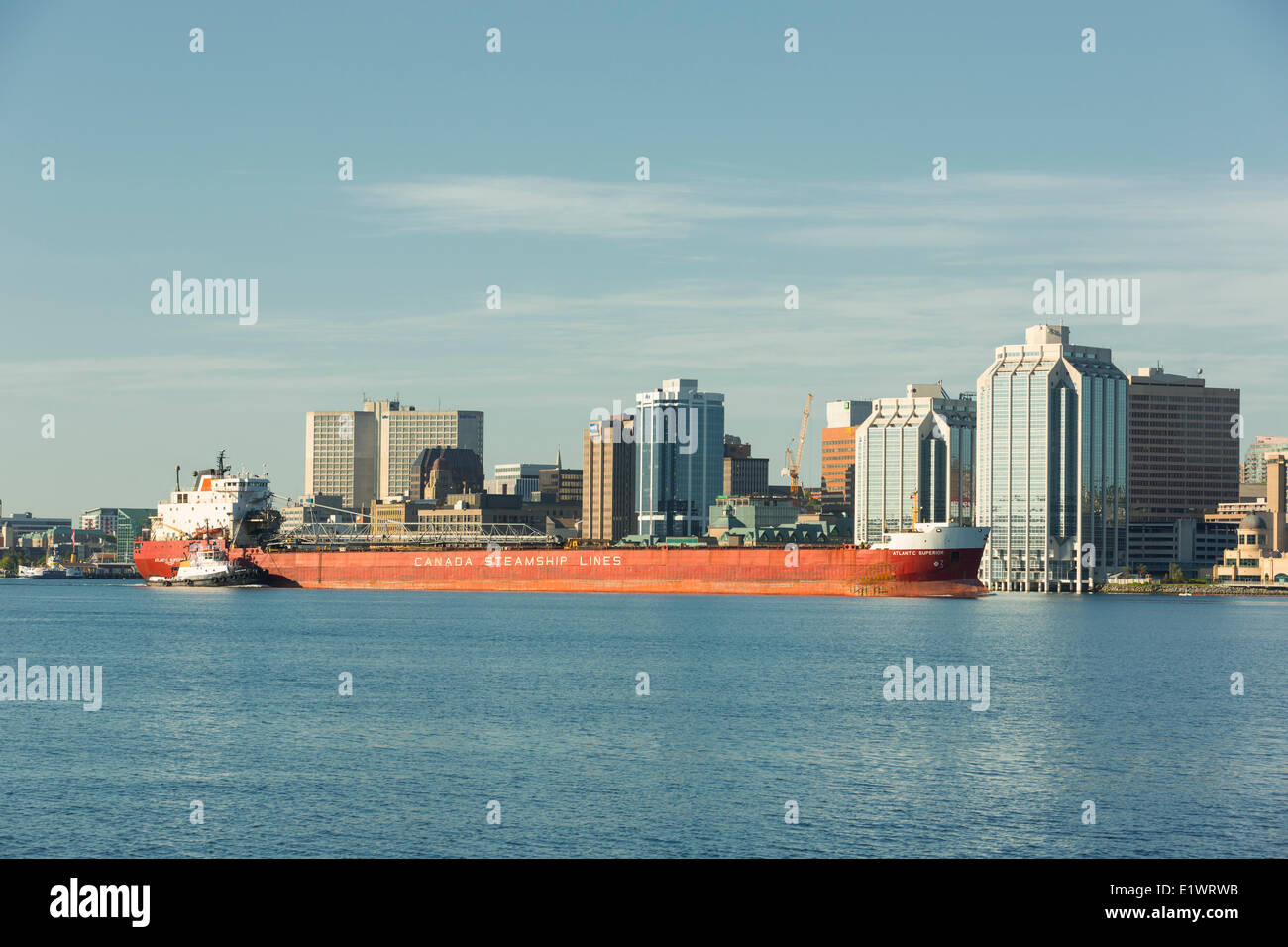 Canadian steamship lines ship being escorted by tugboat, Halifax Harbour, Nova Scotia, canada Stock Photo