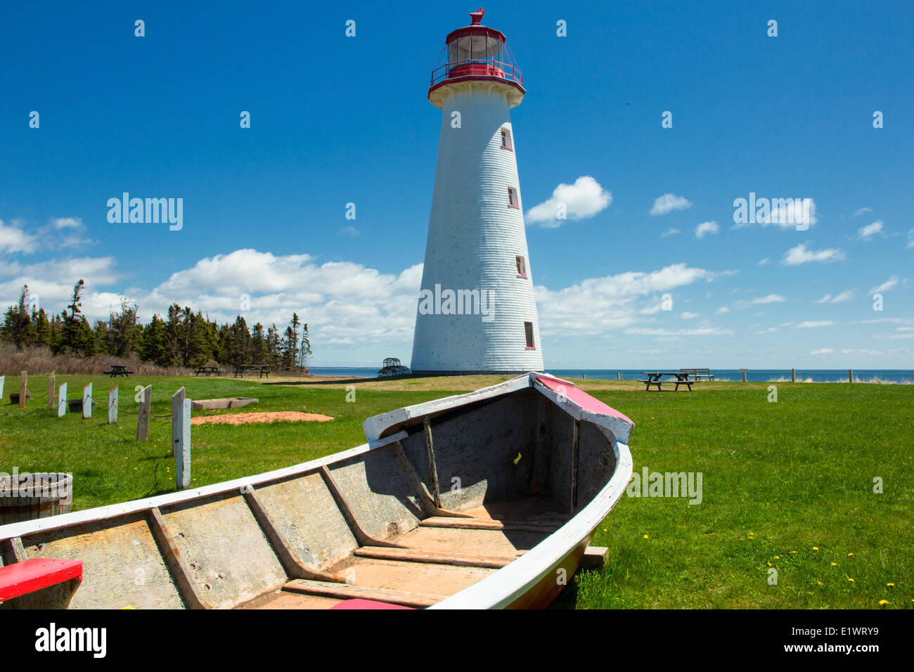 Lighthouse and wooden dory, Point Prim, Prince Edward island, Canada Stock Photo