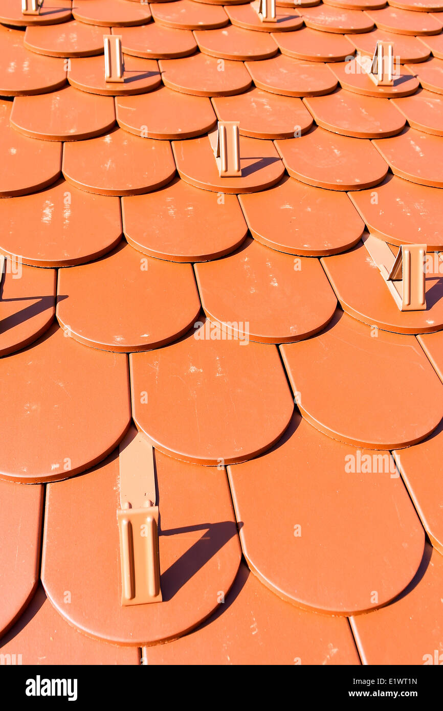 Detail of modern red roof with snow guards Stock Photo - Alamy
