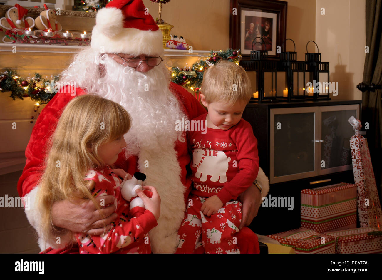 Children meeting with santa during Christmas Stock Photo