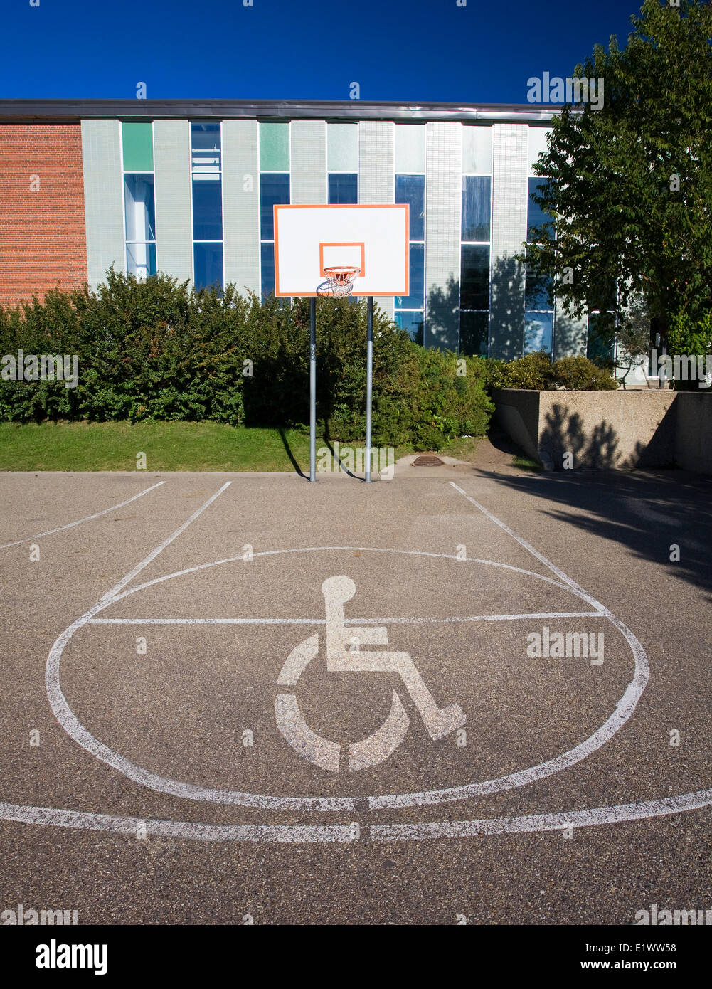 Basketball court with handicap symbol superimposed on court. Stock Photo