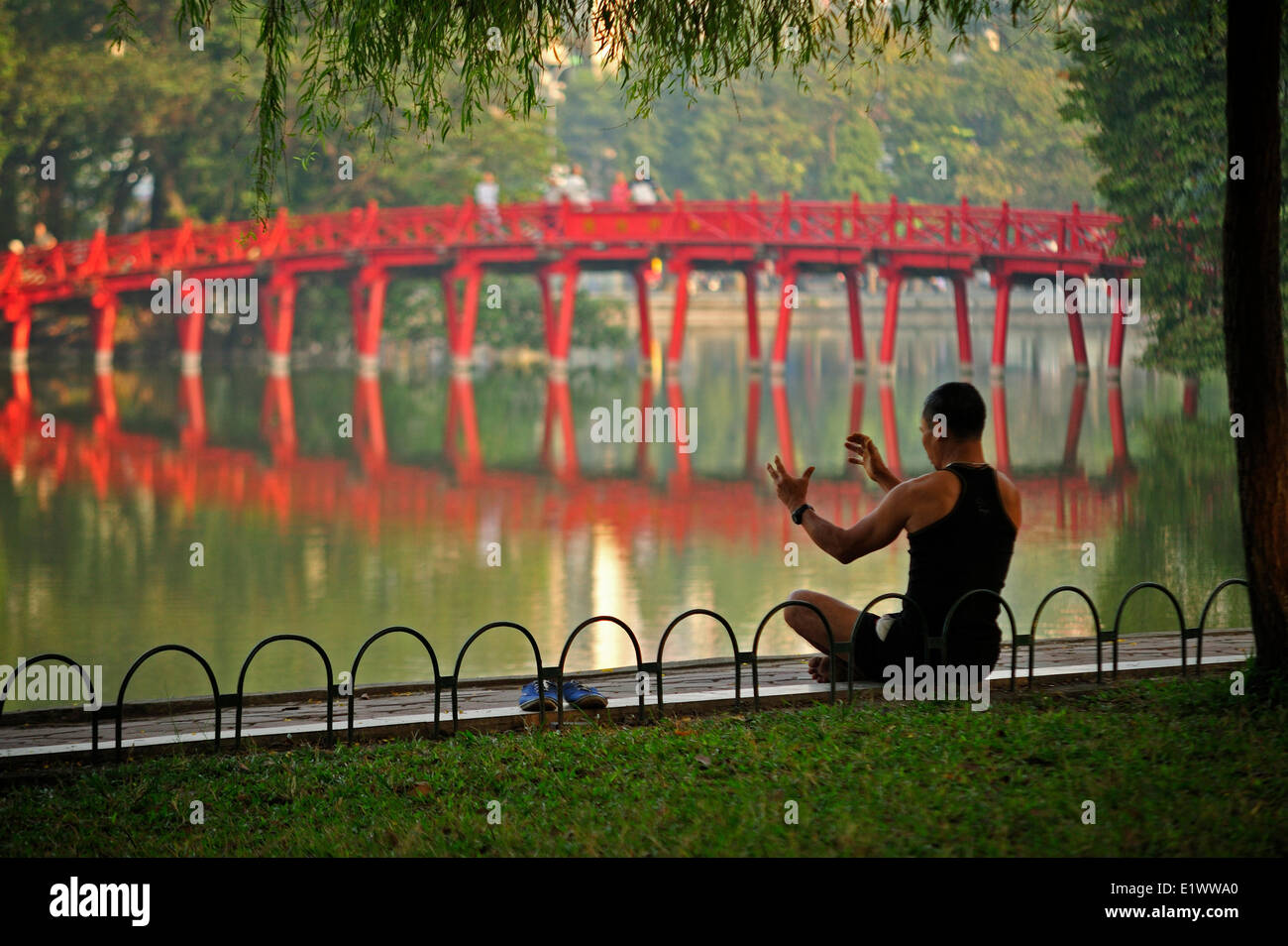 early morning exercises beside Hoan Kiem Lake, Hanoi, Vietnam Stock Photo