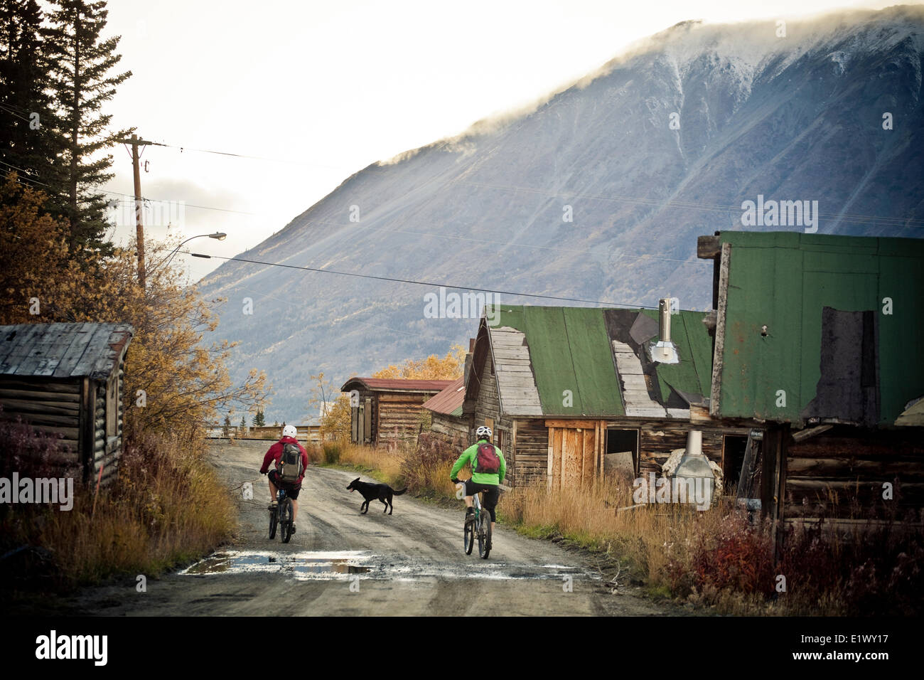 Two male mountain bikers head home after a day of riding singletrack in Carcross, Yukon Stock Photo