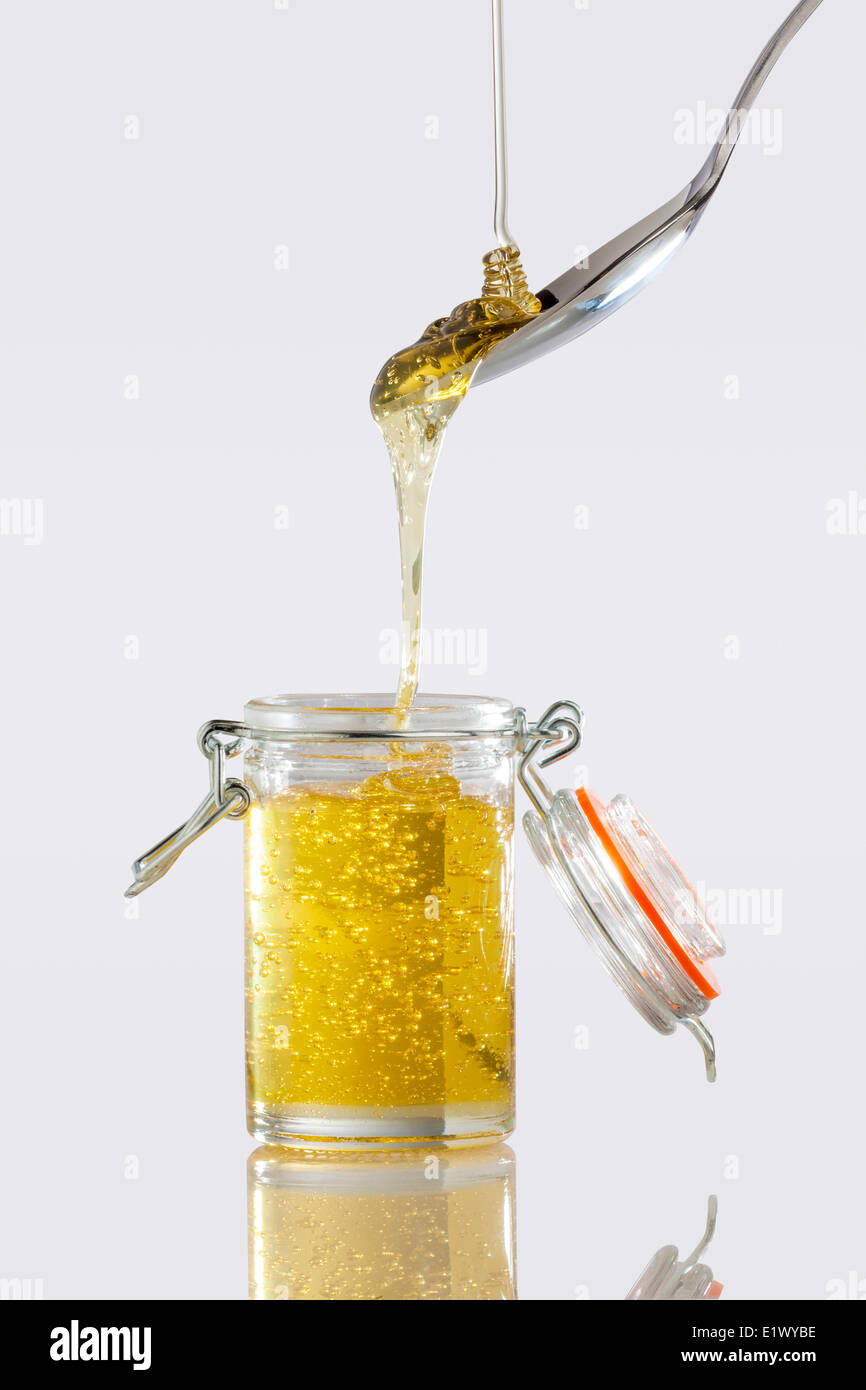 Pouring honey into jar hires stock photography and images Alamy