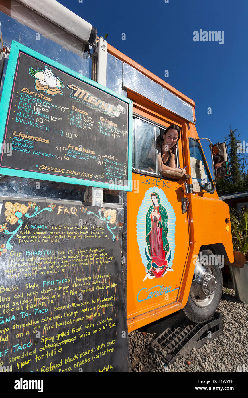 A unique popular food vendor is the curbside eatery Tacofina Bus where fresh Mexican food is prepared for an always hungry Stock Photo