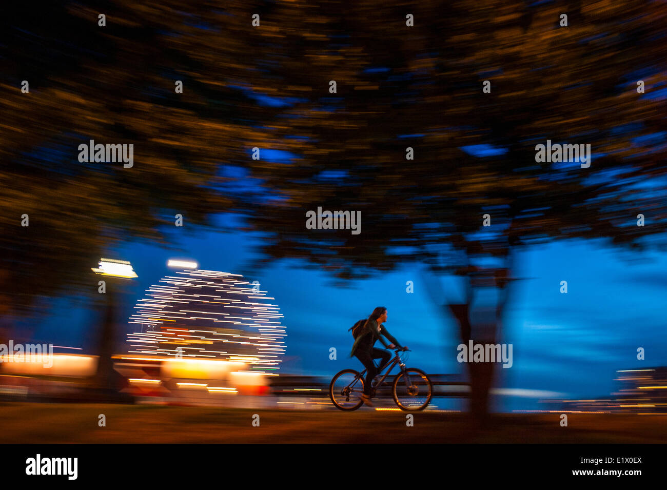 Bicycling by science world at dusk. Stock Photo
