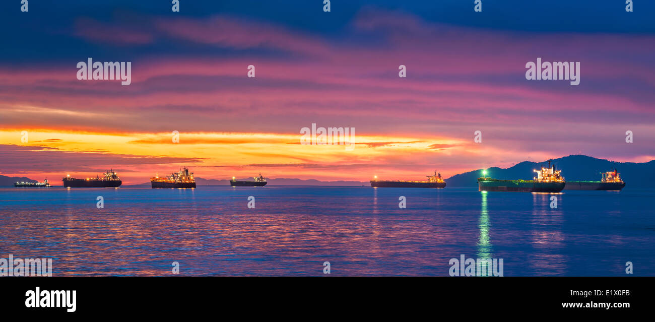 Freighters at sunset, Burrard Inlet, Vancouver, British Columbia, Canada Stock Photo