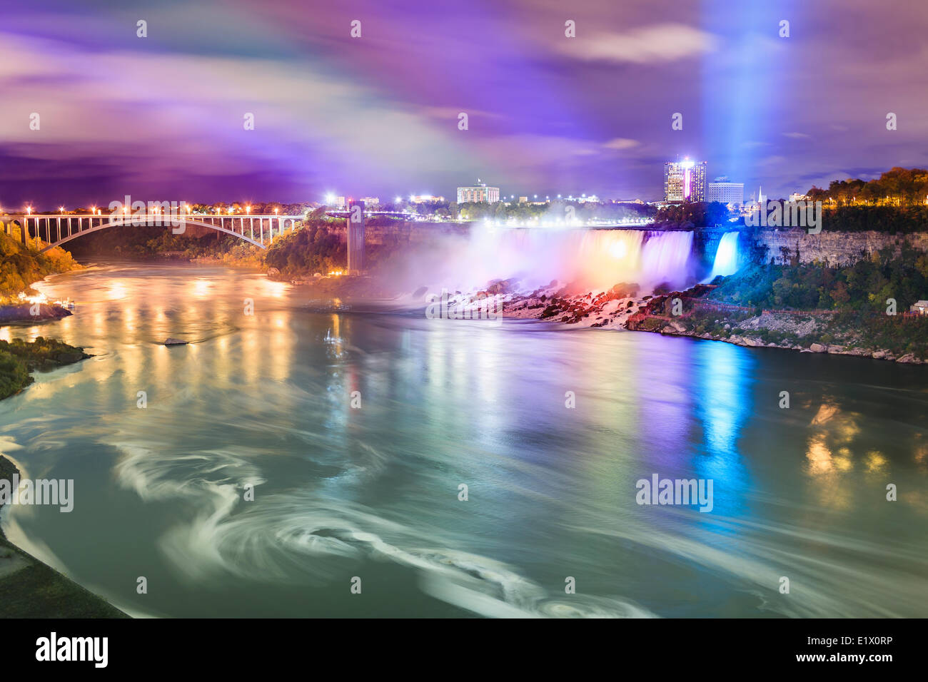 American Falls Rainbow Bridge lit up at night Niagara Falls New York USA viewed the Canadian side the Niagara River Ontario Stock Photo