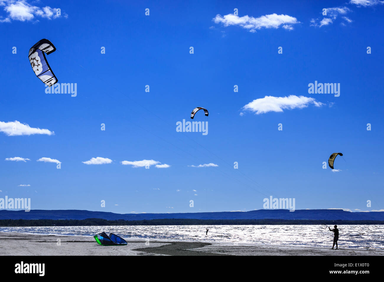Kitesurfers flying kites on Wasaga Beach, Lake Huron, Ontario, Canada Stock Photo
