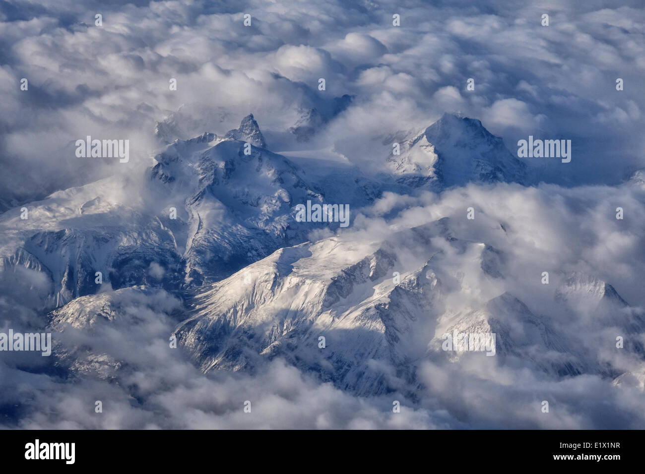 British Columbia's coast mountains seen in an aerial photo along the route between Whitehorse, Yukon and Vancouver, BC. Stock Photo