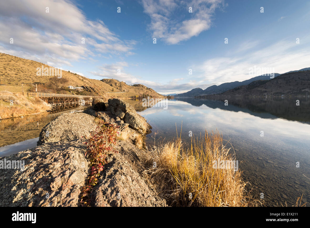 Mountain reflection over Skaha Lake at sunrise with portion the KVR