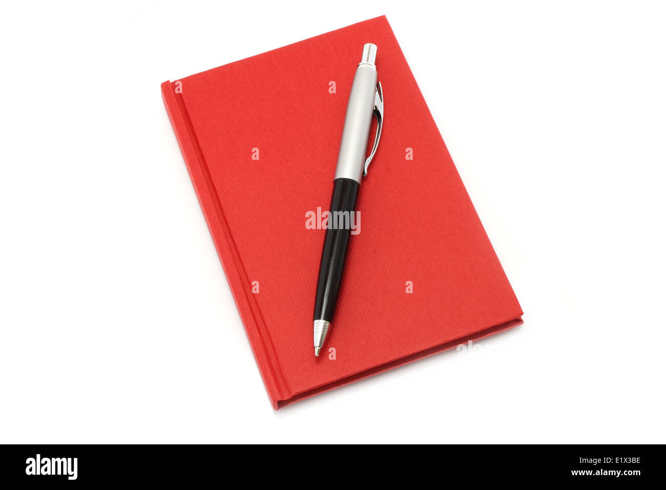 Red notepad with ball pen on a white background Stock Photo - Alamy