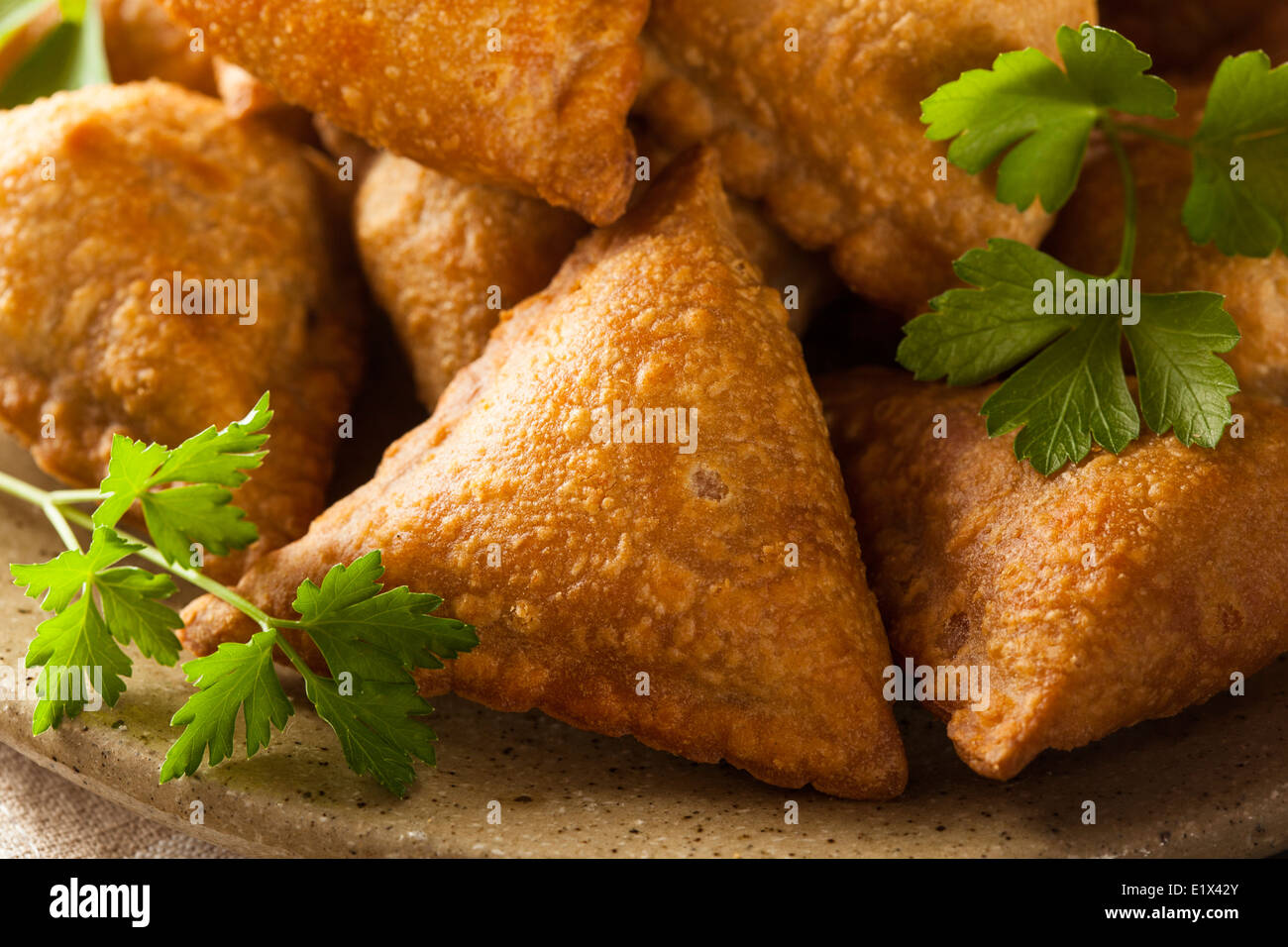 Homemade Fried Indian Samosas with Mint Chutney Sauce Stock Photo