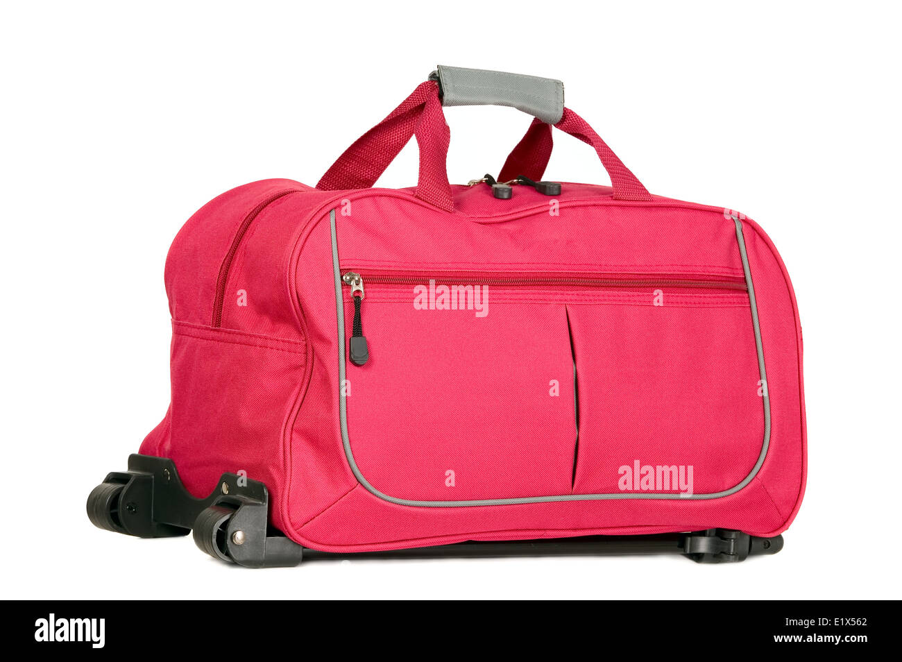 Pink luggage with wheels for travel purposes Stock Photo Alamy