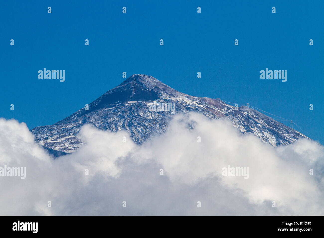 Peak of Mount Teide above the clouds on Tenerife in the Canary Islands, Spain Stock Photo