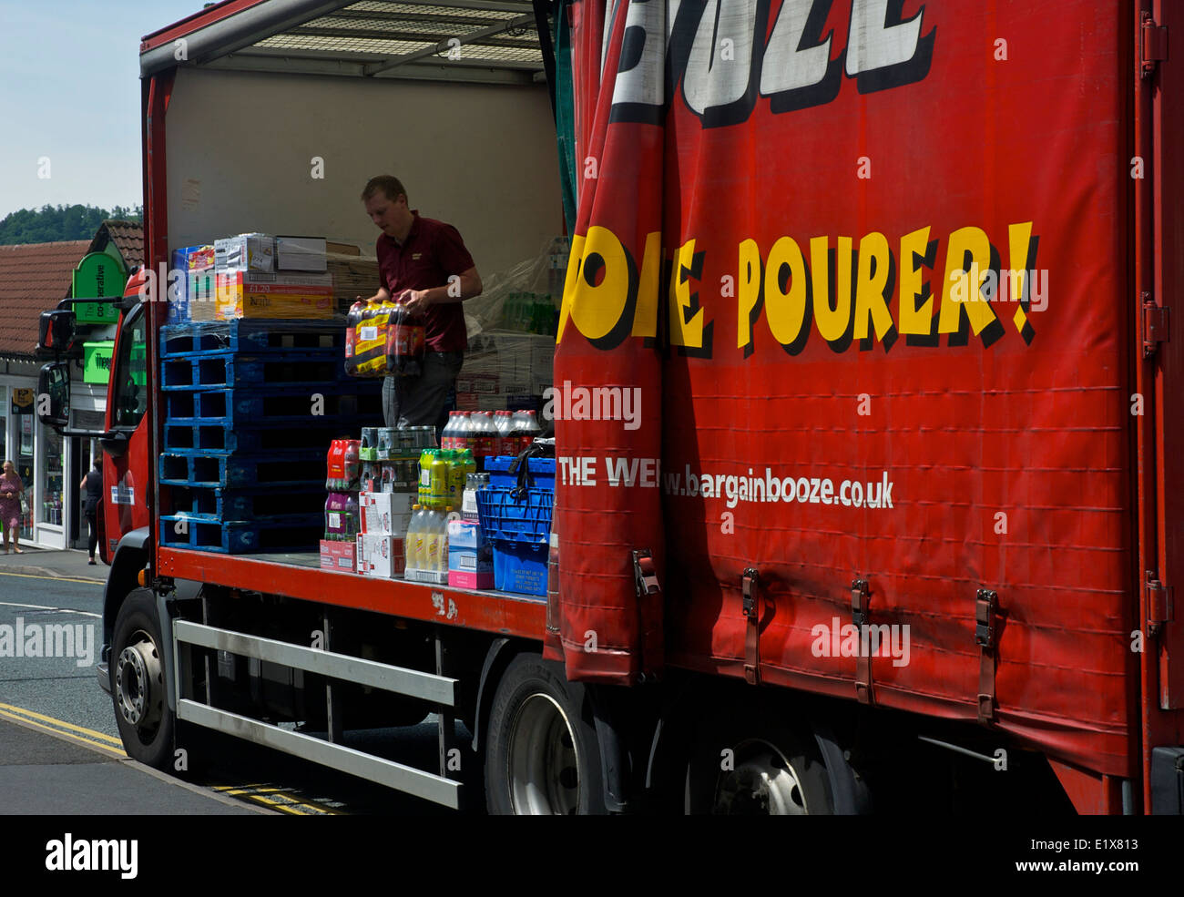 Man unloading Bargain Booze delivery lorry, Bowness, Lake District