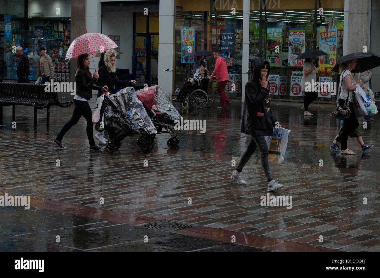 Torrential rain in Argyle Street , Glasgow, as shoppers pass by. Stock Photo