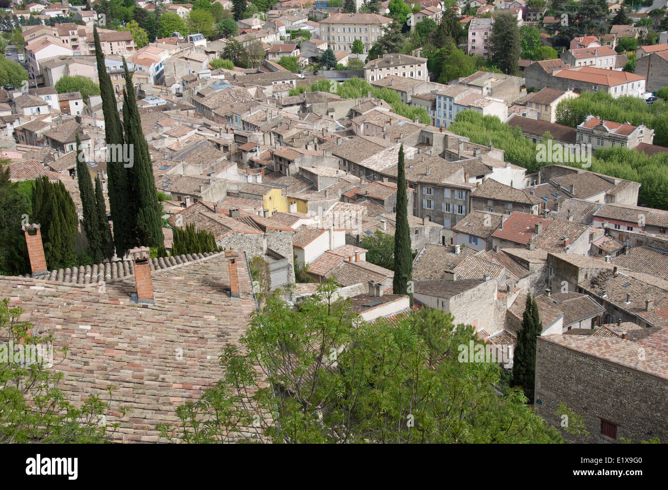 Overlooking the picturesque jumbled rooftops of the old historic French town of Crest, from a high viewpoint on the castle walls. La Drôme in France. Stock Photo