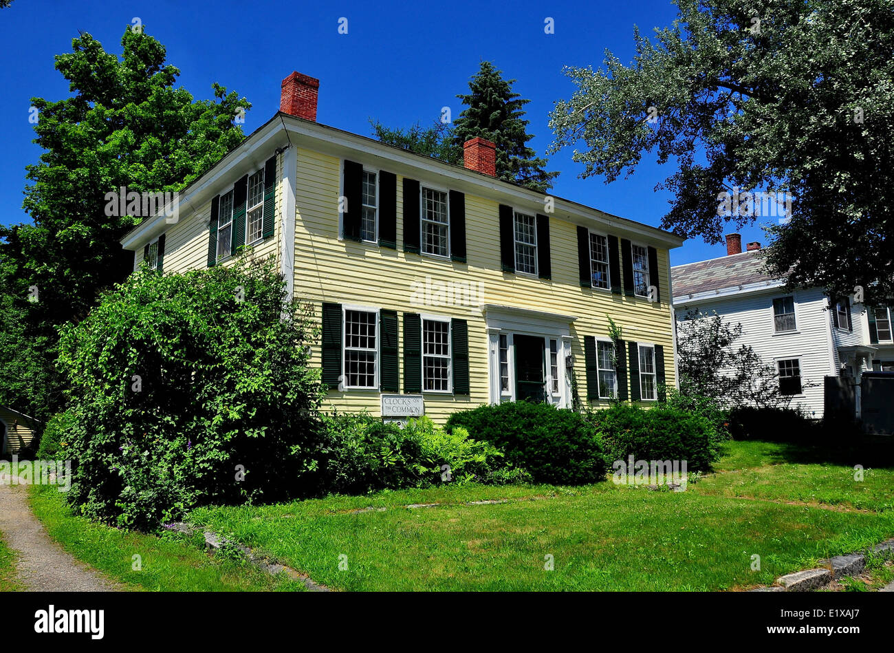 FITZWILLIAM, NEW HAMPSHIRE: Handsome 18th century wooden colonial house with dual chimneys  * Stock Photo