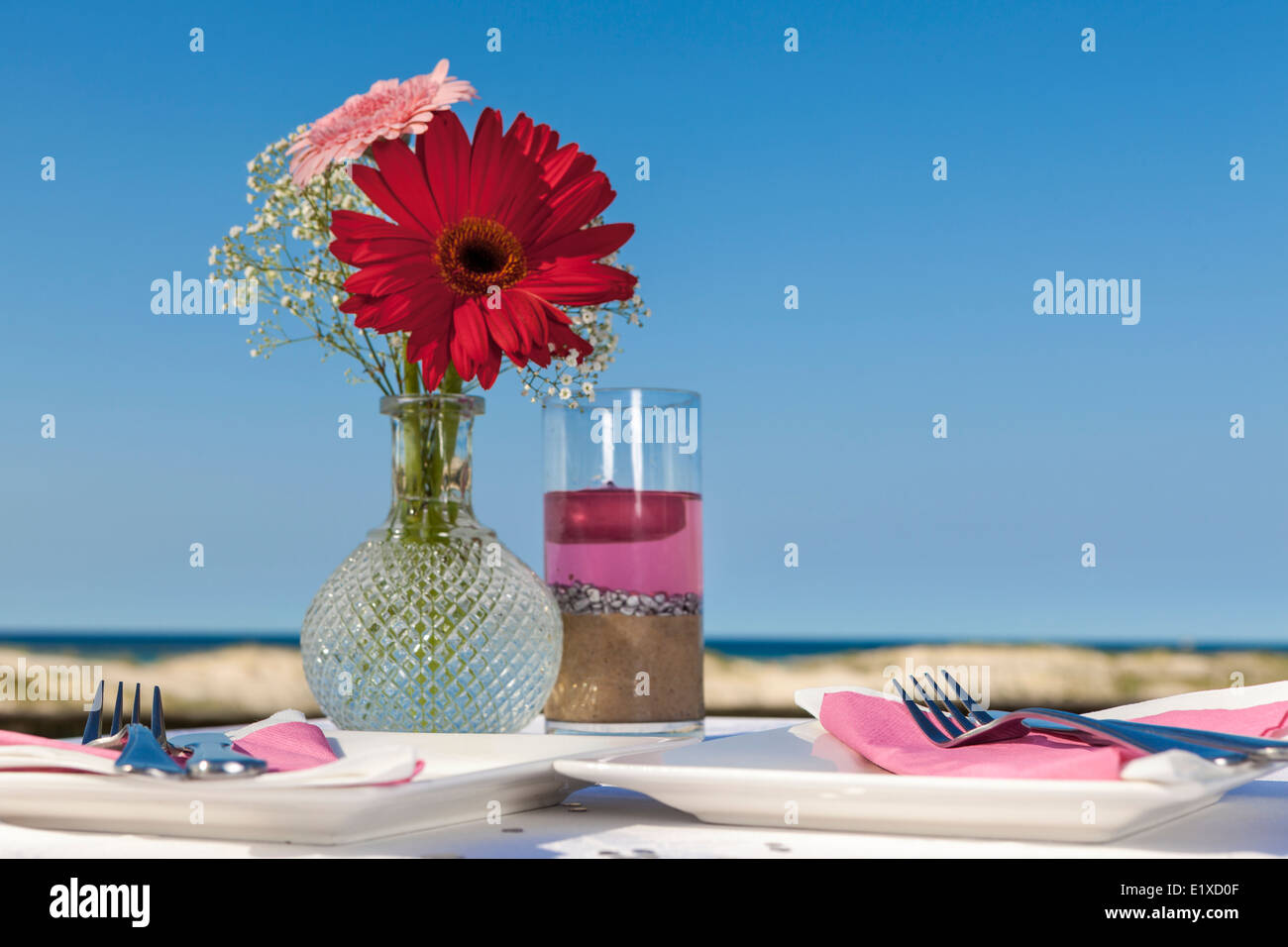 Table set for two on the beach stock photo alamy