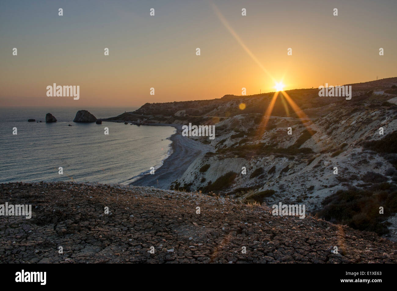 Sunset on Aphrodites rock and bay Stock Photo