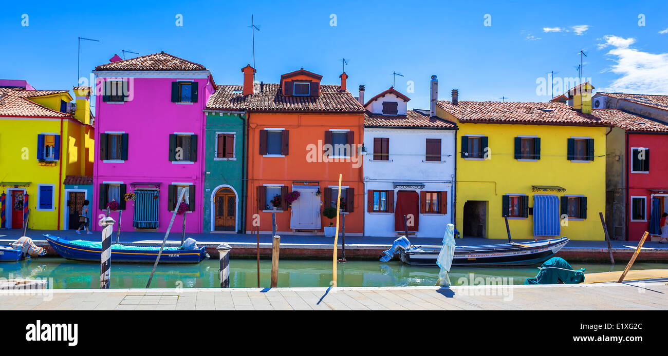 Colorful street with canal in Burano, near Venice, Italy Stock Photo