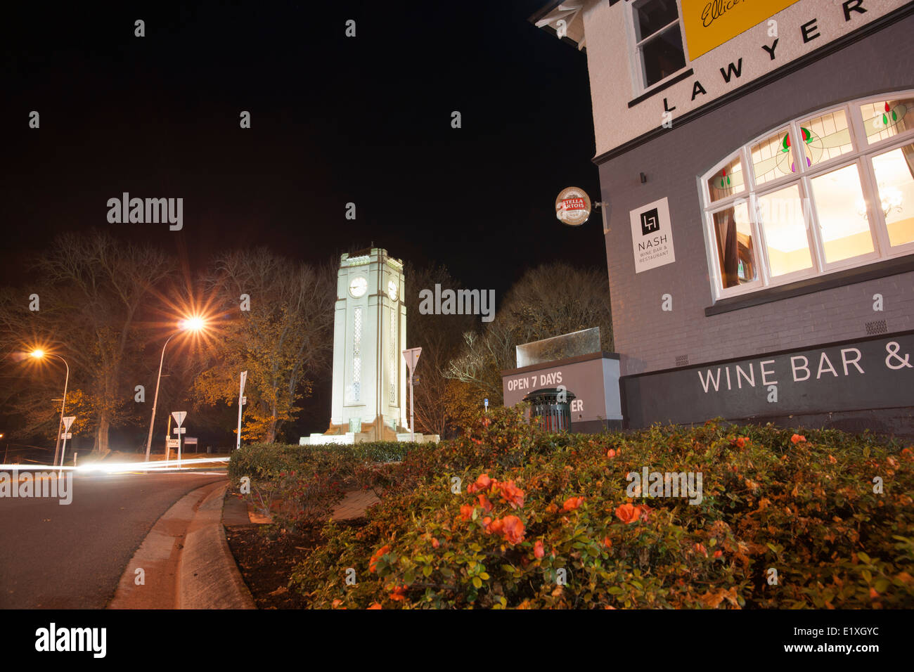 Cambridge clock tower across the intersection, night scenes, street and buildings. New Zealand. Stock Photo