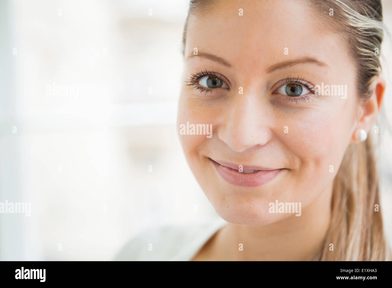 Close-up portrait of beautiful young woman smiling Stock Photo - Alamy