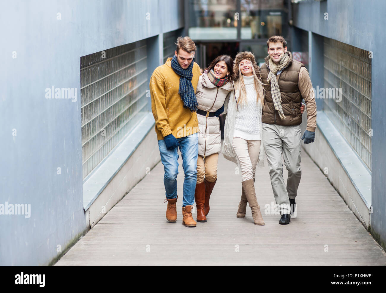 Full length of young friends on walkway Stock Photo