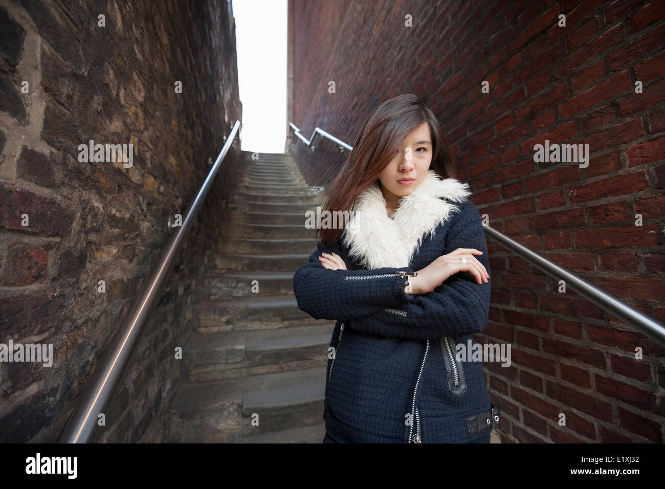 Woman crossed arms hi-res stock photography and images - Alamy
