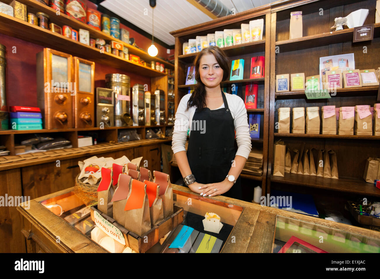 Portrait of female salesperson working in coffee shop Stock Photo