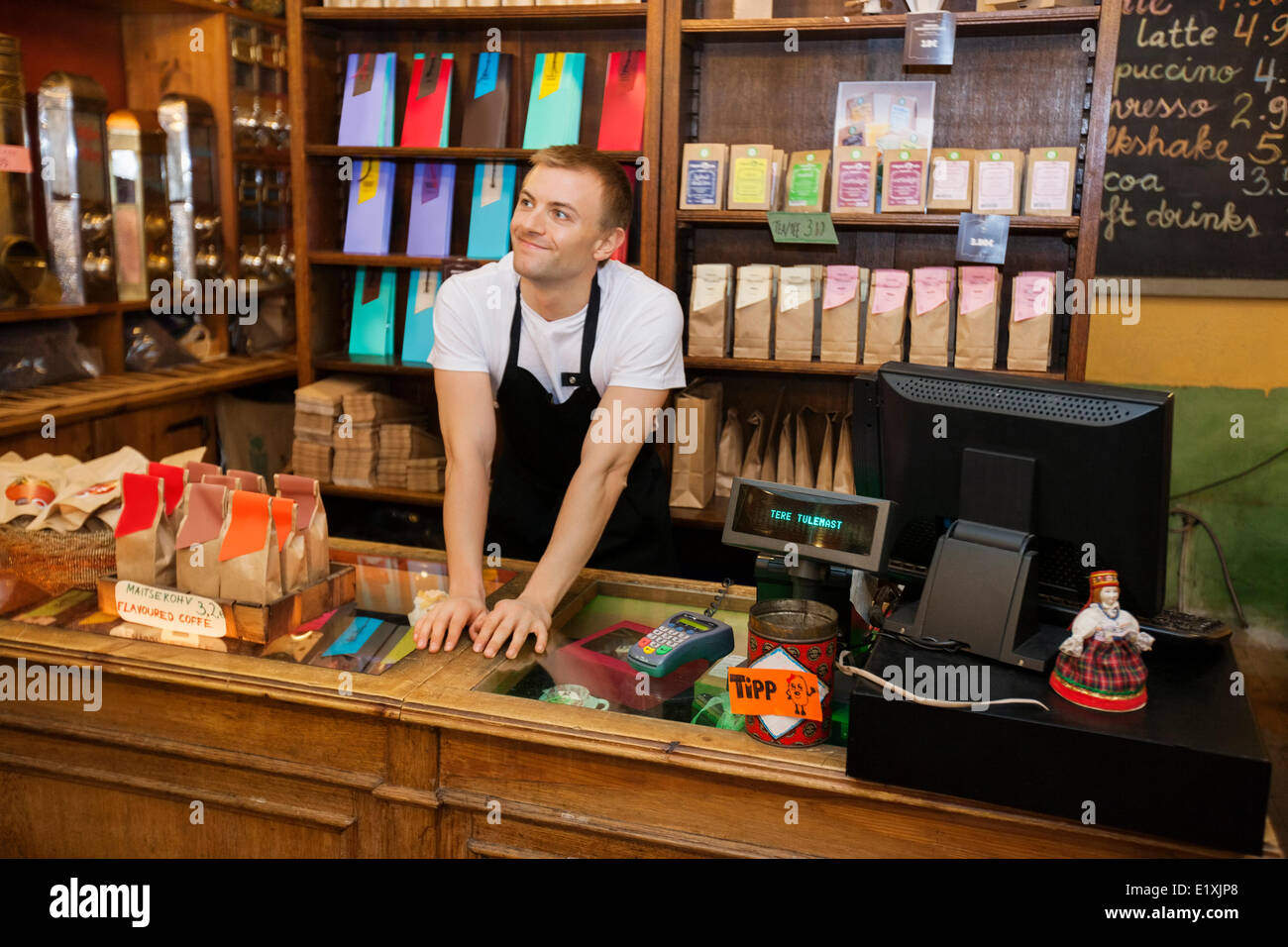 Portrait of confident salesperson in coffee store Stock Photo