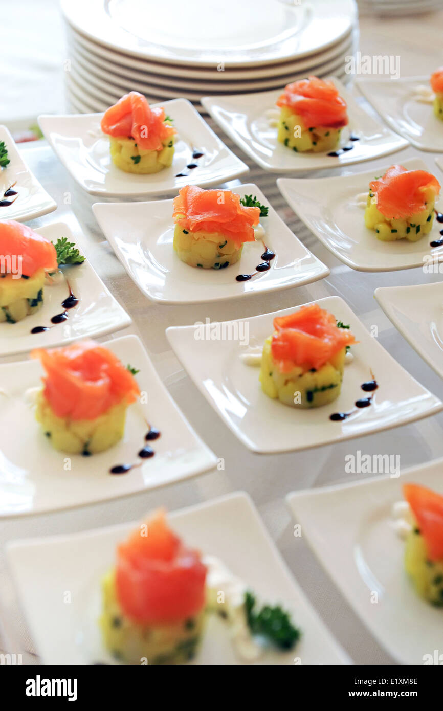 Plates of smoked salmon appetizers Stock Photo
