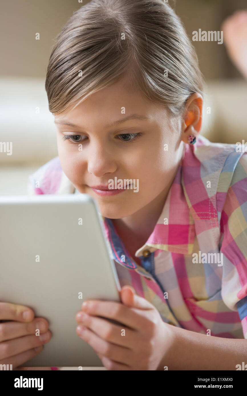 Close-up of girl using digital tablet at home Stock Photo