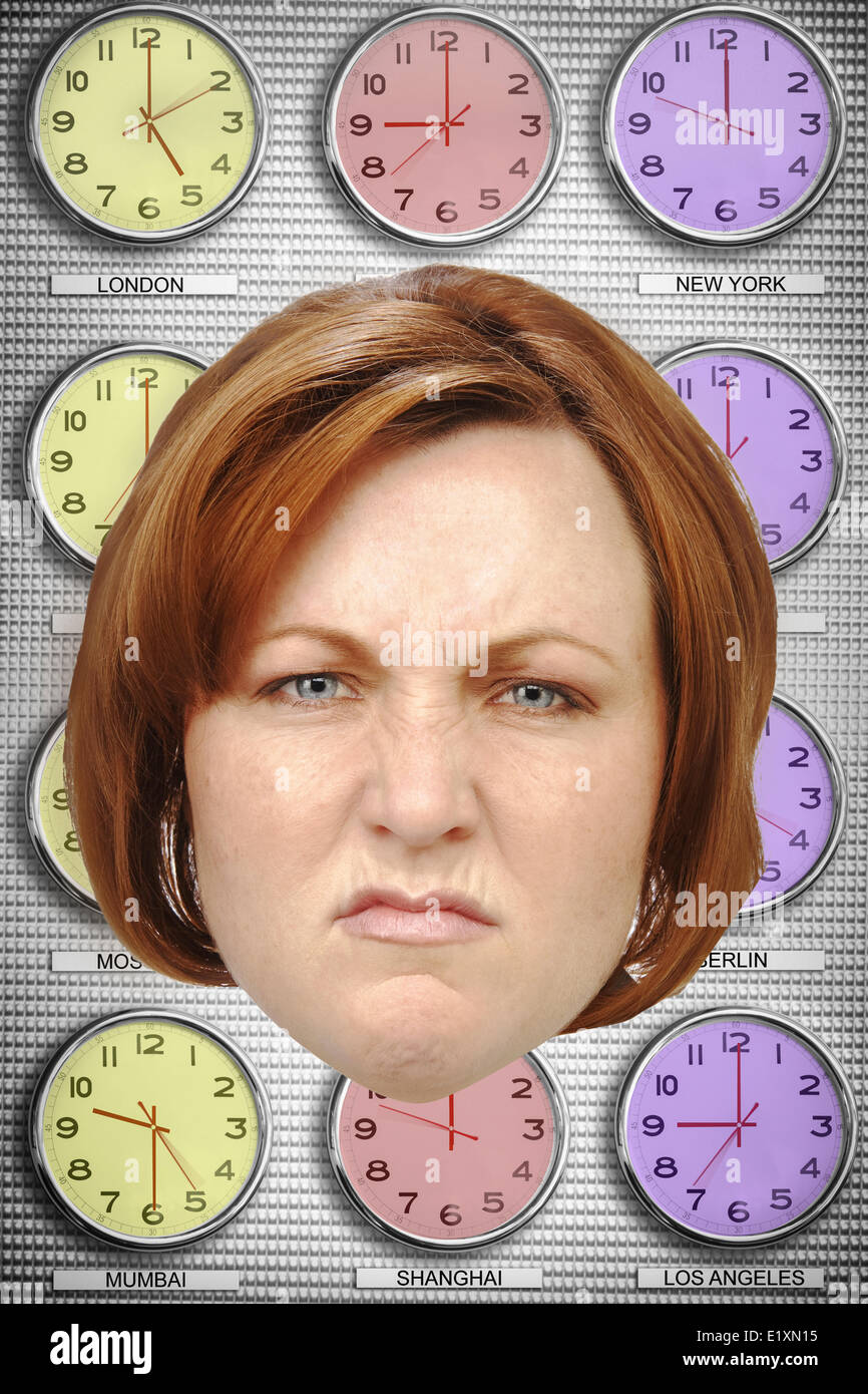 Headshot of angry businesswoman with different time zone clocks in background Stock Photo