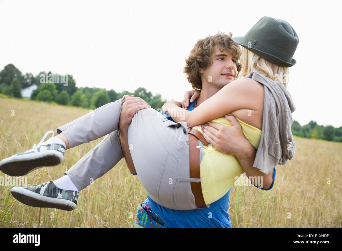 Man carrying woman hi-res stock photography and images - Alamy