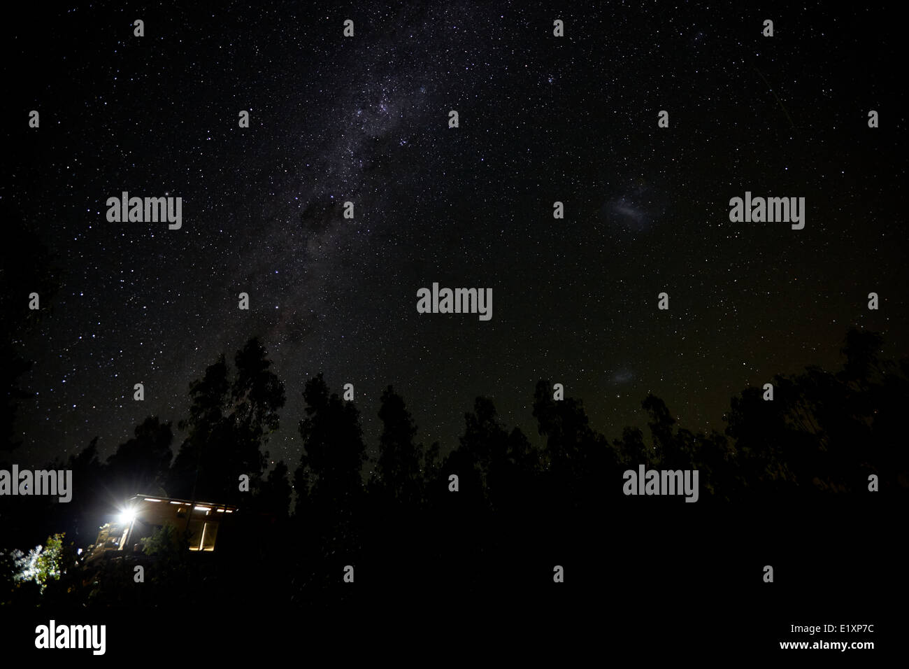 milky way and stars in the sky over woods in los pellines chile Stock Photo