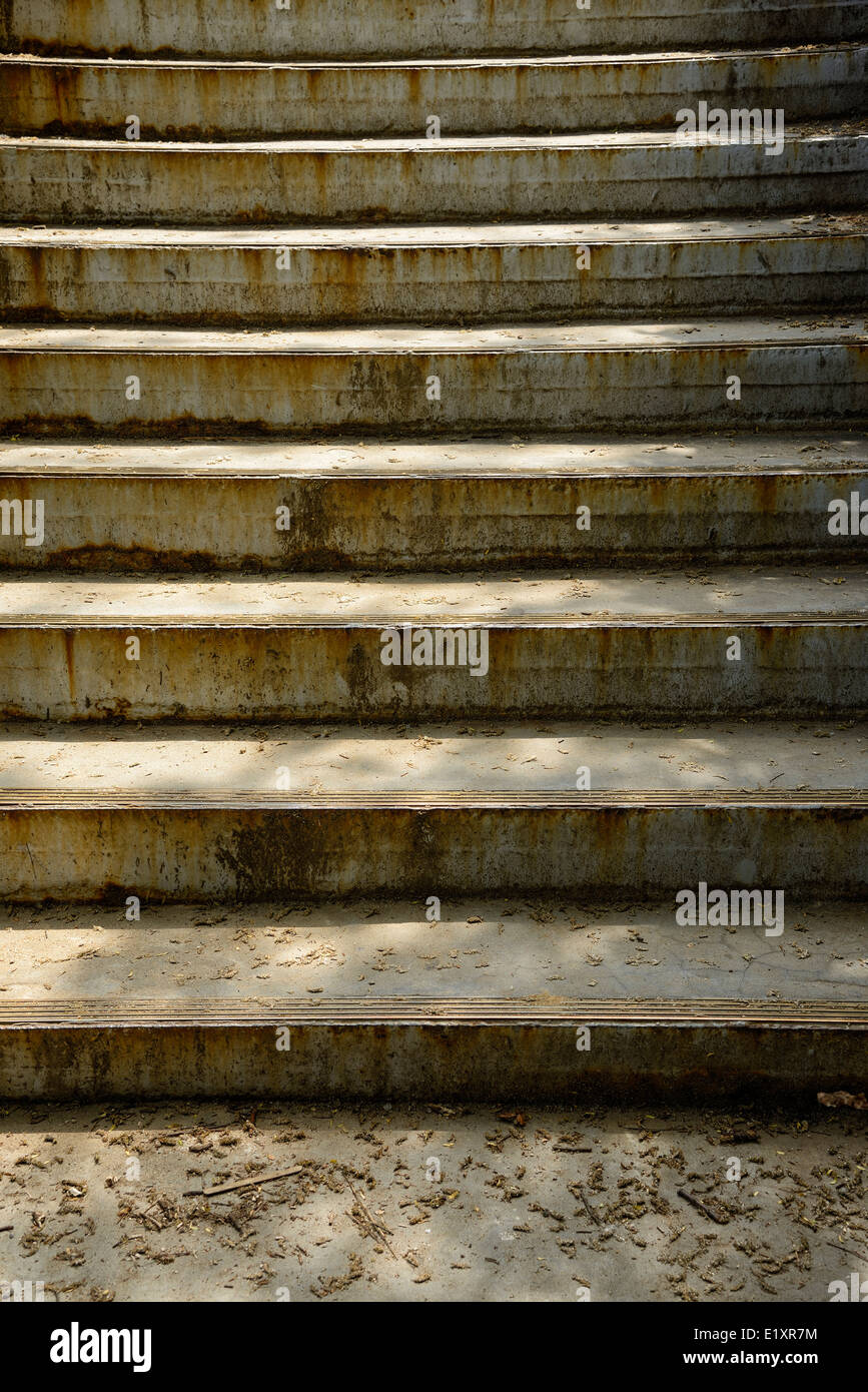 pattern of old concrete stairs with warm light Stock Photo