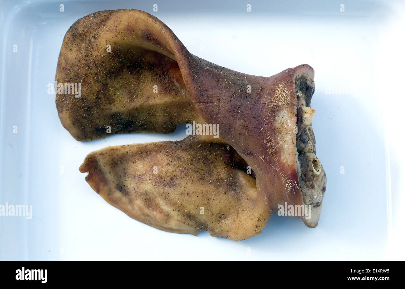 Pig's ear delicacy eating dish pork cooking cook Stock Photo Alamy