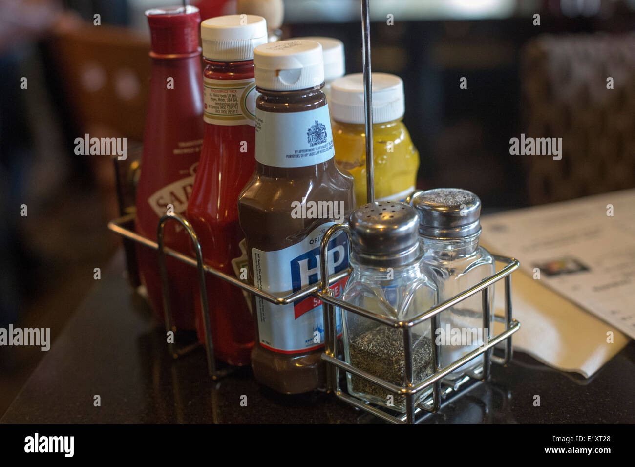 Condiments sauces on lunch table rack sauce Stock Photo