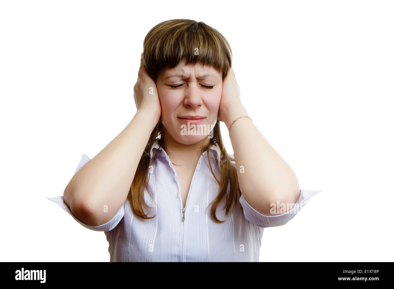 young girl covers his ears with his hands Stock Photo Alamy