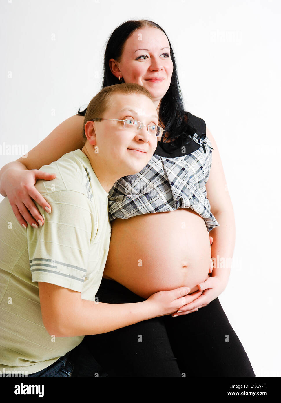 A pregnant woman and a man Stock Photo - Alamy