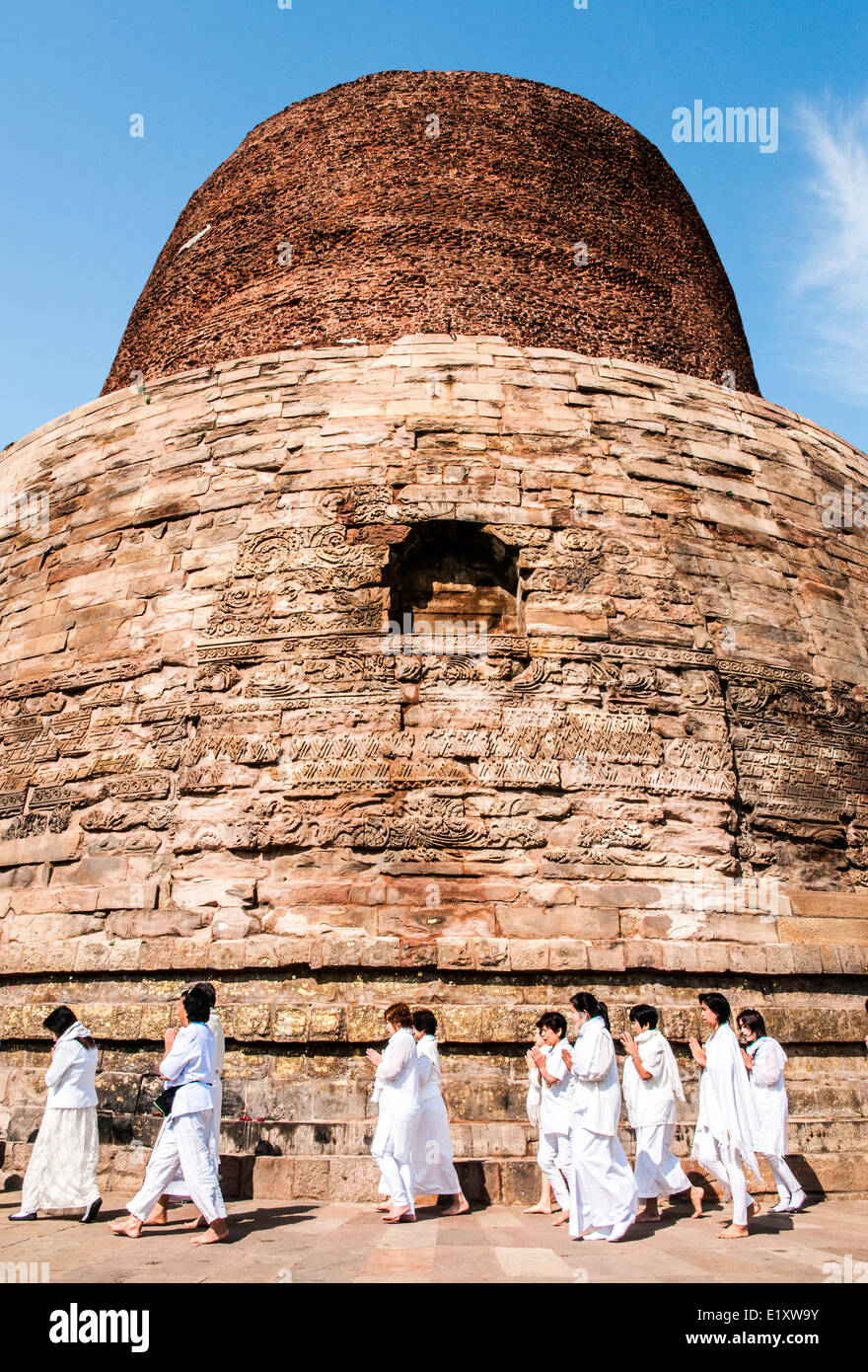 Worshipers at the Dhamekh Stupa, Sarnath where Gautama Buddha first taught the Dharma, Near Varanasi India Stock Photo
