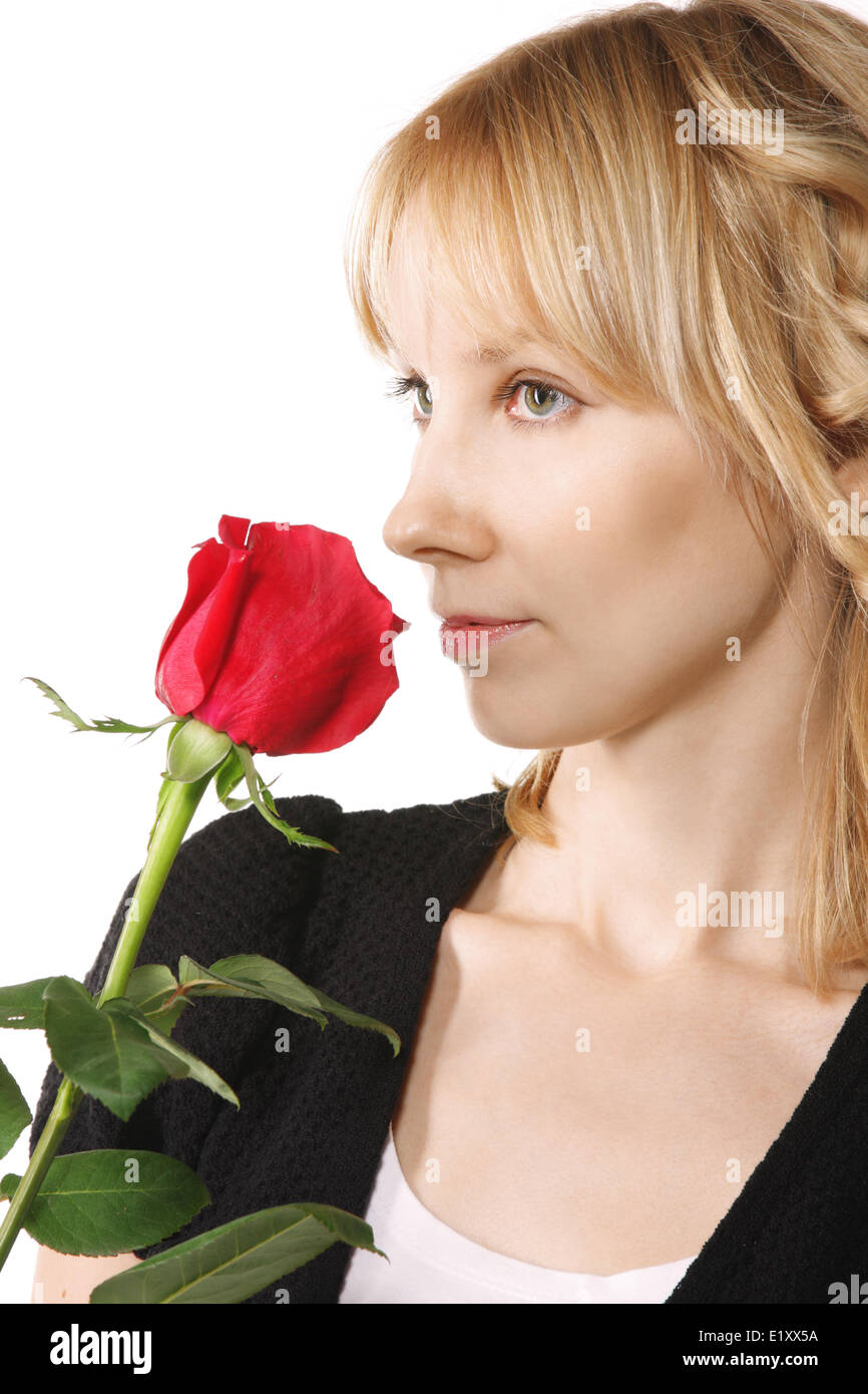 Young woman with red rose sideview Stock Photo - Alamy