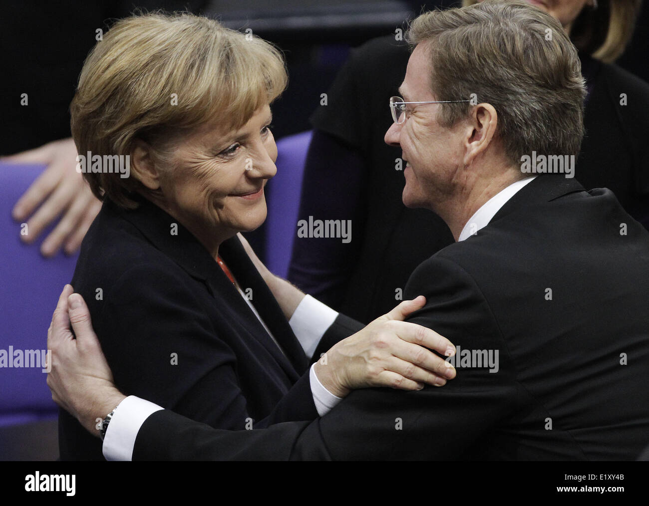 Chancellor Angela Merkel (CDU) hugs designated vice-chancellor Guido Westerwelle (FDP). Foto: Hannibal dpa    (c) dpa - Report    Stock Photo