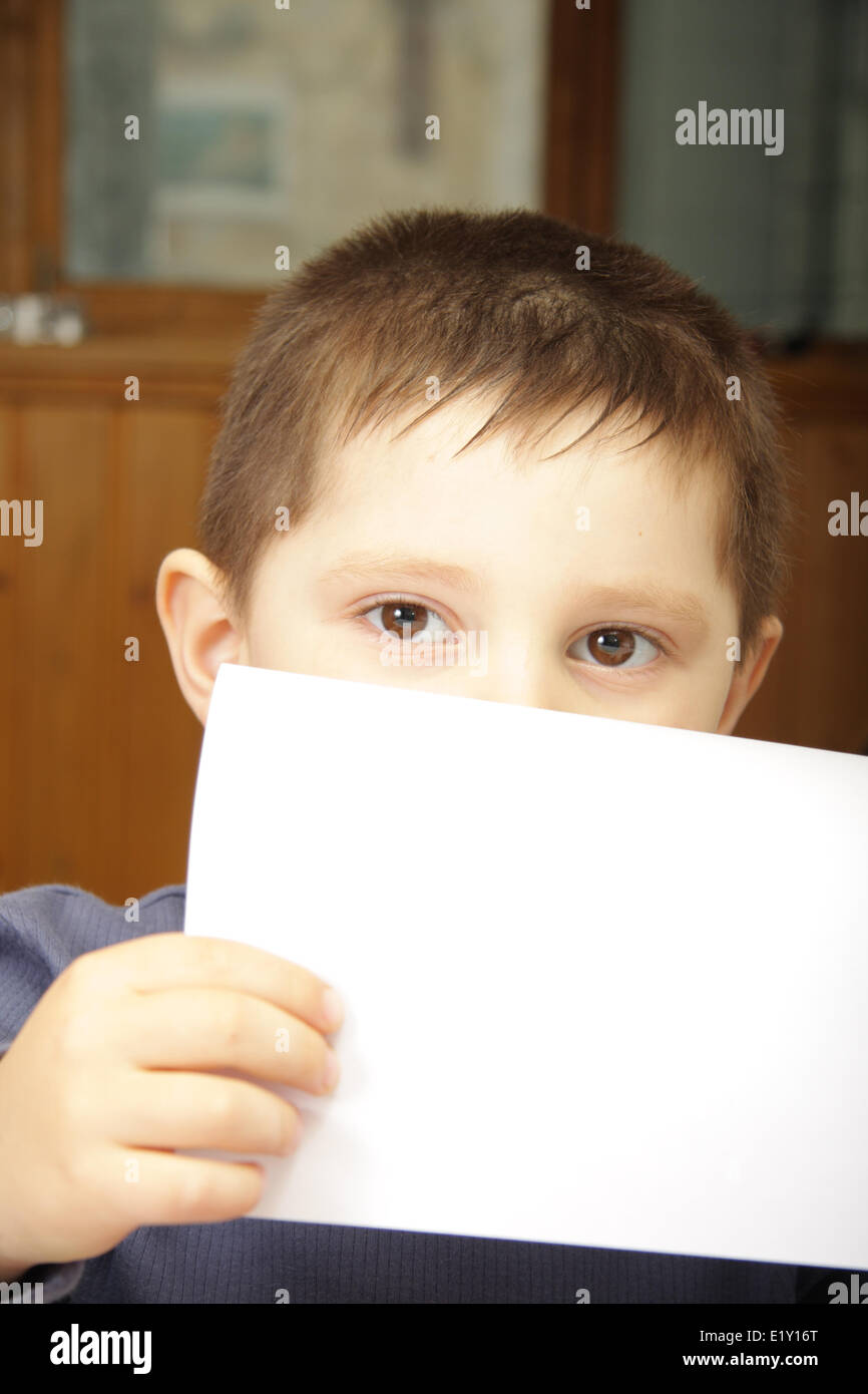 Boy Using Paper Boy with white paper Stock Photo - Alamy