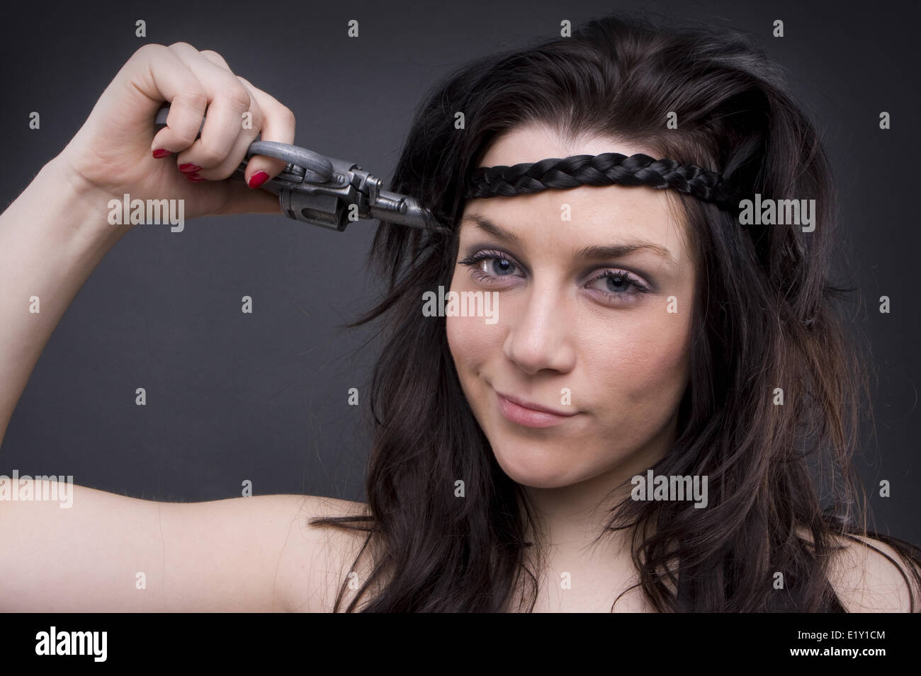 Gun At Womans Head Stock Photo