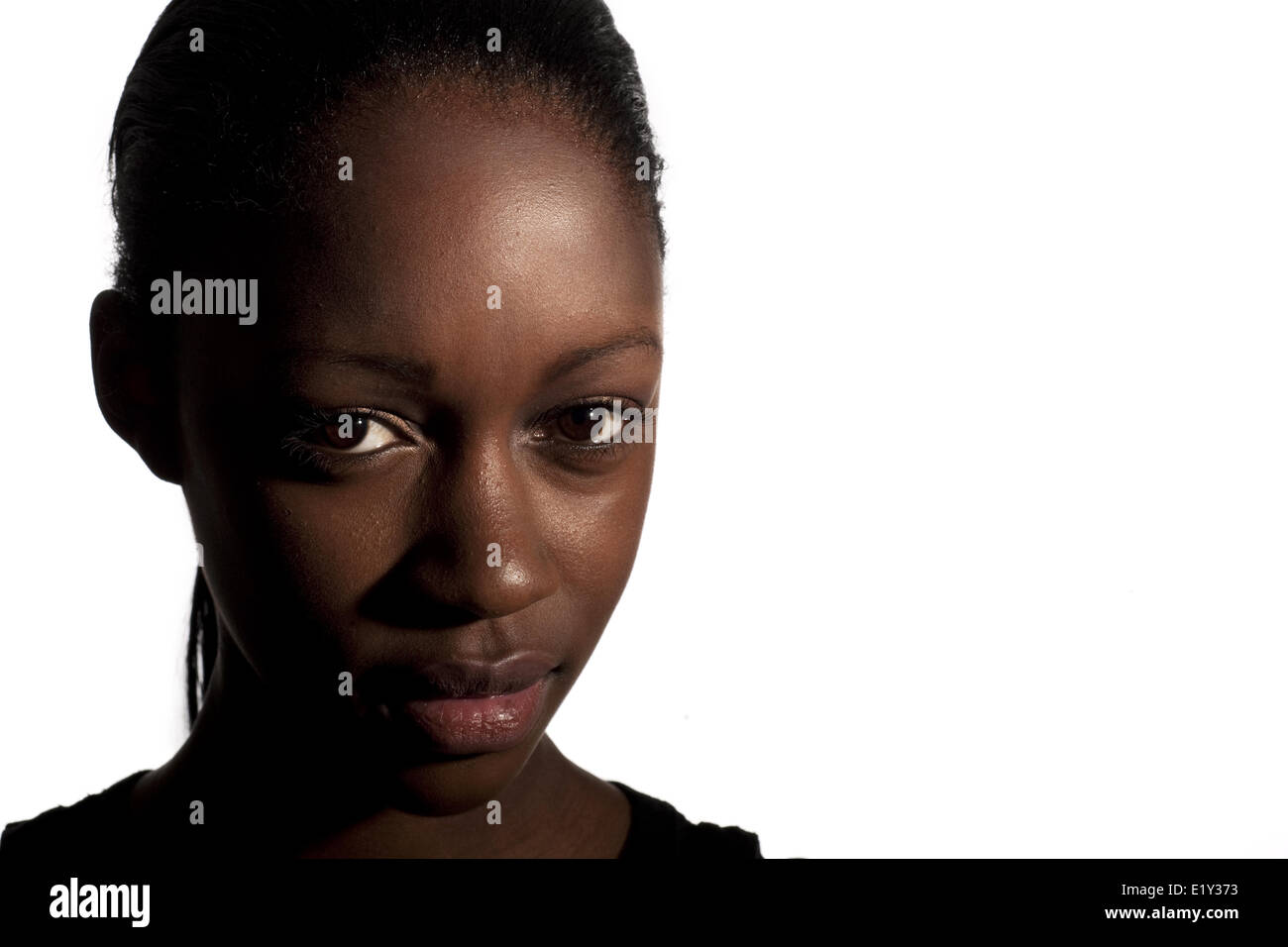 An attractive black girl making eye contact Stock Photo