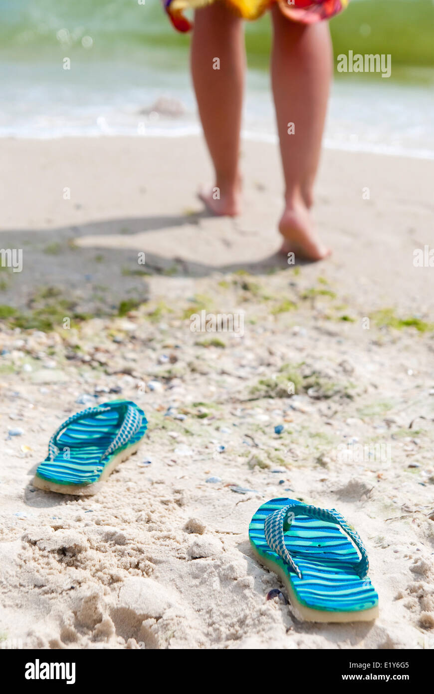 Flip-flops on beach Stock Photo - Alamy
